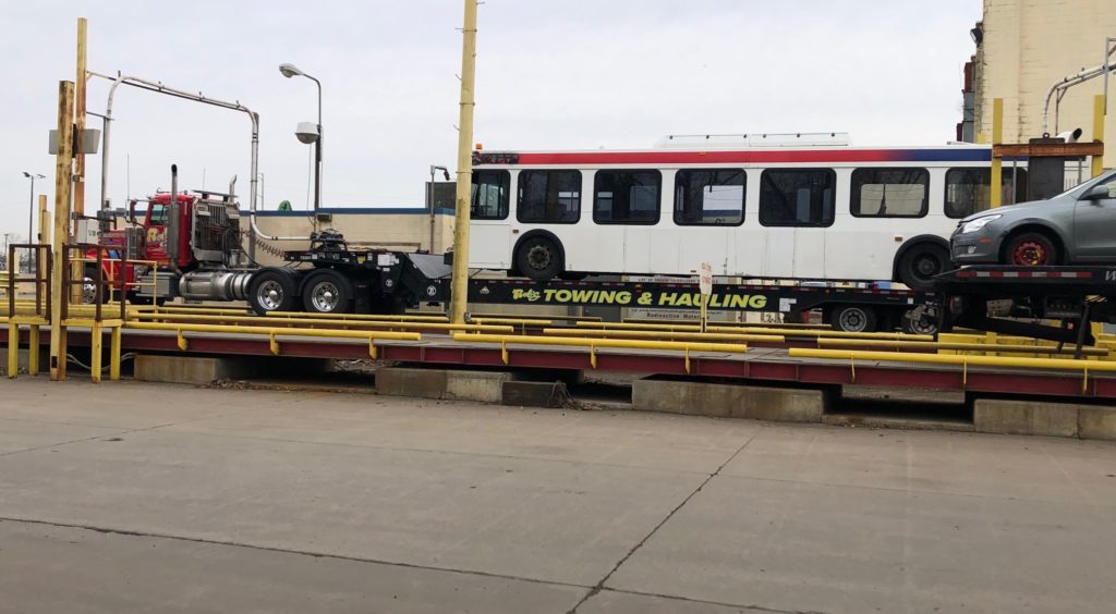 Scrap bus on a hauling truck